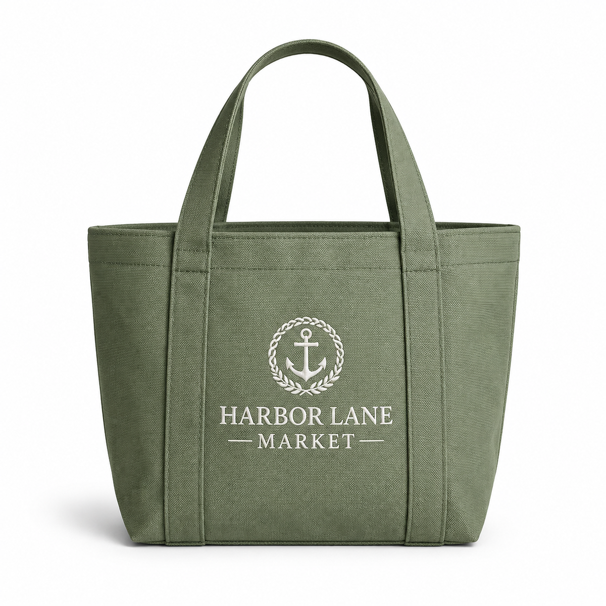 Sage green canvas tote bag with dual shoulder straps featuring custom printed Harbor Lane Market anchor emblem logo.