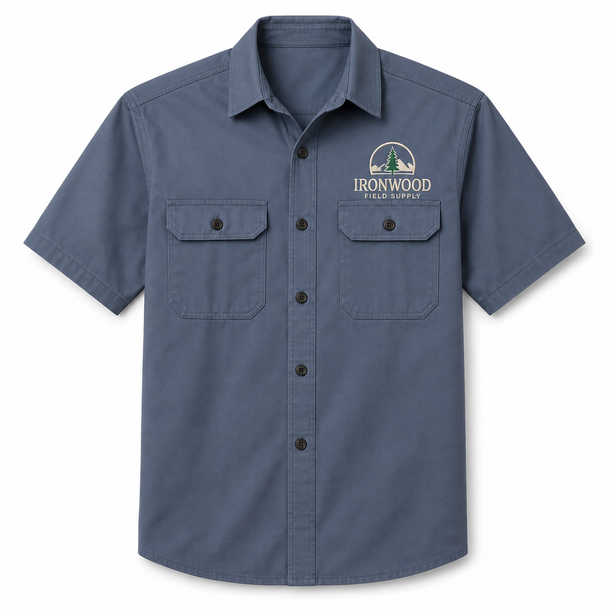 Slate blue short sleeve button-up work shirt with dual chest pockets featuring custom printed Ironwood Field Supply pine tree logo.